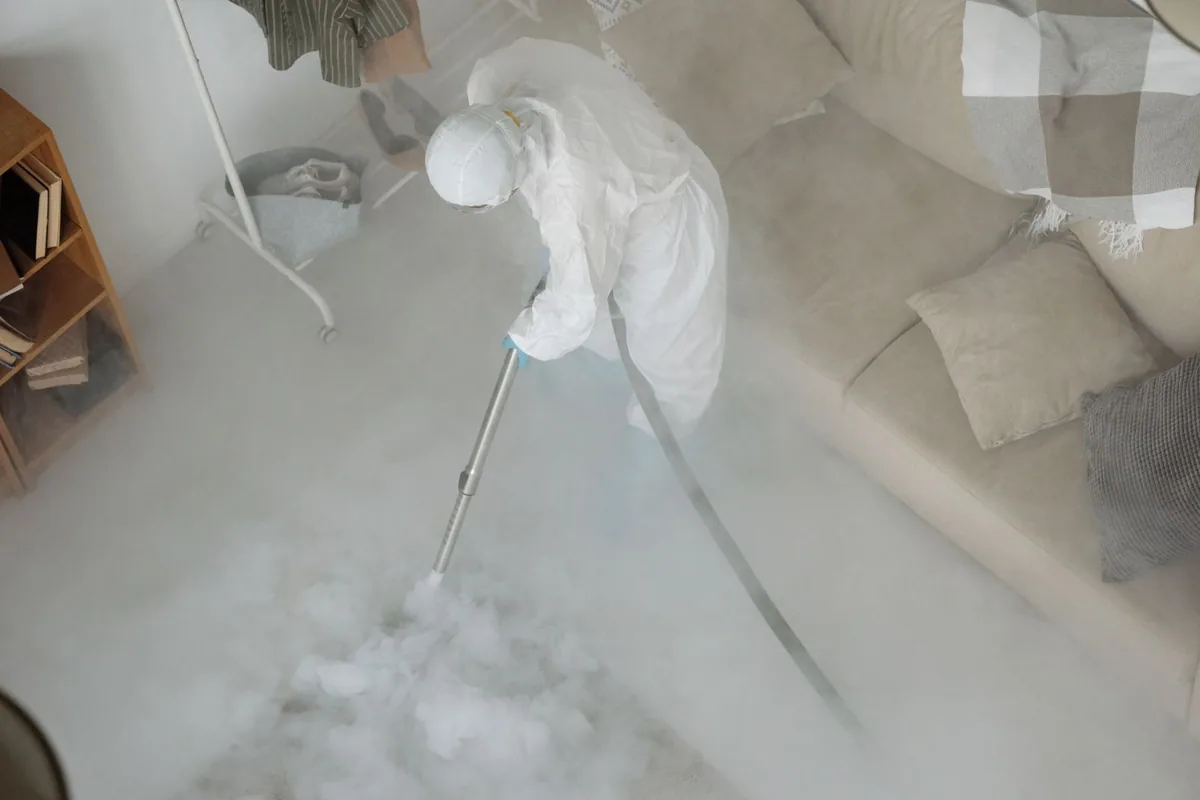 Biohazard cleanup technician in protective equipment, Northwest Harwich, MA